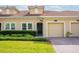 Well maintained single Gathering home featuring a red tile roof, manicured lawn, and a one-car garage at 1079 Quaker Ridge Ln, Davenport, FL 33896
