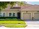Well maintained single Gathering home featuring a red tile roof, manicured lawn, and a one-car garage at 1079 Quaker Ridge Ln, Davenport, FL 33896