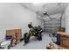 A well-lit two car garage with white walls and a motorcycle at 1079 Quaker Ridge Ln, Davenport, FL 33896