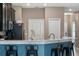 Kitchen featuring dark wood cabinets, white countertops, and stainless steel appliances at 1079 Quaker Ridge Ln, Davenport, FL 33896