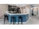 Eat-in kitchen with breakfast bar, modern appliances, and views to the front entry hall at 1079 Quaker Ridge Ln, Davenport, FL 33896
