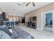 Spacious living room with open access to kitchen and breakfast bar seating at 1079 Quaker Ridge Ln, Davenport, FL 33896