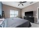 Main bedroom featuring a big screen tv and a bright and airy atmosphere at 1079 Quaker Ridge Ln, Davenport, FL 33896