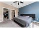 Bright main bedroom with large bed and walk-in closet and ensuite bath at 1079 Quaker Ridge Ln, Davenport, FL 33896
