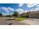 Street view of single Gathering homes featuring red tile roofs, manicured lawns, and garages at 1079 Quaker Ridge Ln, Davenport, FL 33896