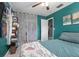 Stylish bedroom featuring a walk-in closet, modern ceiling fan, and natural lighting at 1090 Wakefield Cir, Deltona, FL 32725