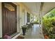 Welcoming front porch features comfortable seating and lush greenery, creating a relaxing outdoor space at 1090 Wakefield Cir, Deltona, FL 32725