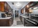 Efficient kitchen with stainless steel appliances, sleek countertops, and modern fixtures at 1090 Wakefield Cir, Deltona, FL 32725