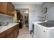 Charming laundry area featuring a modern washer and dryer set, adjacent to the kitchen for added convenience at 1090 Wakefield Cir, Deltona, FL 32725