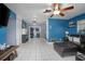Spacious living room with ample natural light, sliding glass doors, and neutral tile flooring at 1090 Wakefield Cir, Deltona, FL 32725