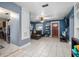 Open-concept living room with tile flooring provides seamless transition to the kitchen at 1090 Wakefield Cir, Deltona, FL 32725