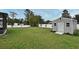 The backyard features a shed and a privacy fence, perfect for outdoor storage and privacy at 116 Neal Dr, Deltona, FL 32738