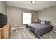 A bedroom featuring carpeted floors, a queen-sized bed, and a TV at 116 Neal Dr, Deltona, FL 32738