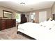 A neutral-colored bedroom featuring carpet and dark wood furniture at 116 Neal Dr, Deltona, FL 32738