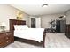A well-lit bedroom featuring a dark wood bed set and neutral-colored walls at 116 Neal Dr, Deltona, FL 32738