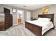 A carpeted bedroom featuring a dark wood bed set and neutral-colored walls at 116 Neal Dr, Deltona, FL 32738