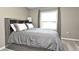 A neutral bedroom featuring carpet and a full-size bed with a headboard at 116 Neal Dr, Deltona, FL 32738