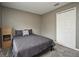 A carpeted bedroom with neutral paint and a queen-sized bed at 116 Neal Dr, Deltona, FL 32738