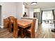 Cozy dining area adjacent to the kitchen, with wooden table and backyard access at 116 Neal Dr, Deltona, FL 32738