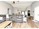 Open-concept living room showcasing a living room with hardwood floors and lots of seating at 116 Neal Dr, Deltona, FL 32738
