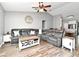 Inviting living room featuring comfortable sofas, a ceiling fan, and hardwood floors at 116 Neal Dr, Deltona, FL 32738