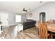 Spacious living room featuring hardwood floors, vaulted ceiling and plenty of natural light at 116 Neal Dr, Deltona, FL 32738