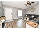 Comfortable living room with hardwood floors, neutral paint colors, and a ceiling fan at 116 Neal Dr, Deltona, FL 32738
