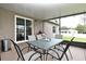 Covered patio with seating and ceiling lights offering outdoor relaxation and dining space at 116 Neal Dr, Deltona, FL 32738