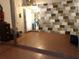 Spacious basement with tiled floors and painted brick wall at 1228 Oakwood Ave, Daytona Beach, FL 32114