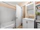 Clean bathroom with white tile shower and bright natural lighting at 1228 Oakwood Ave, Daytona Beach, FL 32114