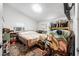 Simple bedroom setup with natural light and an organized closet space at 1228 Oakwood Ave, Daytona Beach, FL 32114