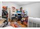 Cluttered bedroom with desk, computer, and lots of comic book decor at 1228 Oakwood Ave, Daytona Beach, FL 32114