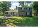 Charming two-story home featuring a well-maintained lawn and traditional architectural details at 1228 Oakwood Ave, Daytona Beach, FL 32114
