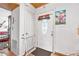 Entryway features a secure white door, creating a welcoming transition into the home at 1228 Oakwood Ave, Daytona Beach, FL 32114