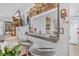 Kitchen bar with gray bar stools and mounted TV provides extra seating and entertainment options at 1228 Oakwood Ave, Daytona Beach, FL 32114