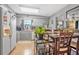 Functional kitchen with gray cabinets, a bright window, and an adjoining dining area at 1228 Oakwood Ave, Daytona Beach, FL 32114