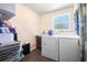 Bright laundry room with modern appliances, including a washer and dryer at 1228 Oakwood Ave, Daytona Beach, FL 32114