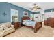 Primary bedroom boasts a ceiling fan and carpeted floors, providing comfort and style at 1309 Wicklow Ln, Ormond Beach, FL 32174