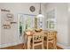 Dining area with hardwood floors and French doors leading to the outdoor space at 1309 Wicklow Ln, Ormond Beach, FL 32174