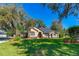 Charming single-story home with manicured lawn, mature trees, and well-maintained landscaping at 1309 Wicklow Ln, Ormond Beach, FL 32174