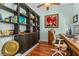 Charming office space showcasing built-in shelving, a wooden desk, and a comfortable chair, perfect for a home office at 1309 Wicklow Ln, Ormond Beach, FL 32174
