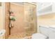 Bathroom with a toilet and a stand-up shower with a glass door at 1343 Rocky Rd, Kissimmee, FL 34744