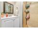 Bathroom with a vanity and a stand-up shower with a glass door at 1343 Rocky Rd, Kissimmee, FL 34744