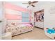 Bright, cheerful bedroom with custom closet, playful decor, and a comfortable bed at 1343 Rocky Rd, Kissimmee, FL 34744