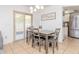 Cozy dining area featuring a stylish light fixture and access to the outdoor patio at 1343 Rocky Rd, Kissimmee, FL 34744