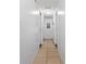 Clean, neutrally decorated hallway leading to various rooms in the home at 1343 Rocky Rd, Kissimmee, FL 34744