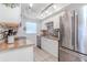 Well-equipped kitchen with stainless steel appliances, granite countertops, and tiled backsplash at 1343 Rocky Rd, Kissimmee, FL 34744