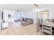 Open-concept living space showcasing tile flooring, neutral tones, and a dining area at 1343 Rocky Rd, Kissimmee, FL 34744