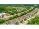Lovely aerial view of home in a well-kept neighborhood situated near a bustling road at 1481 Areca Palm Dr, Port Orange, FL 32128
