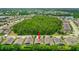 Great aerial view of house in a well-maintained neighborhood surrounded by beautiful trees and greenery at 1481 Areca Palm Dr, Port Orange, FL 32128